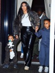 Kim Kardashian and Kanye West head to his album release party with their kids